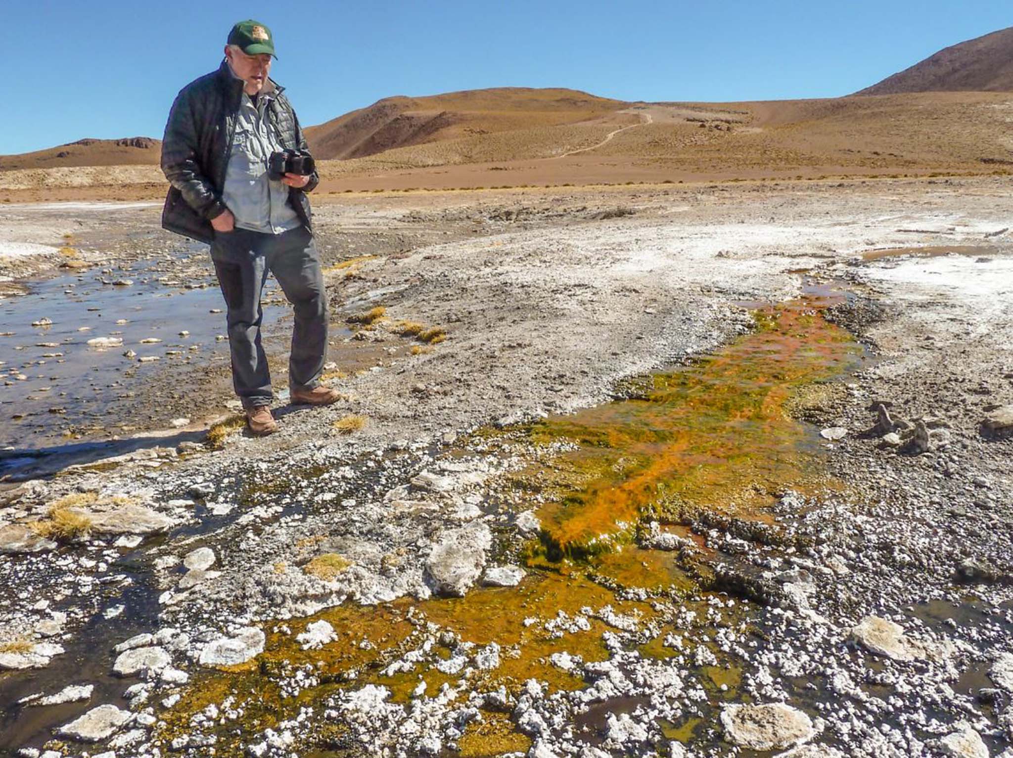 Geoscientist Jack Farmer studying silica deposits at El Tatio hot springs in Chile