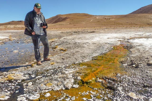 Geoscientist Jack Farmer studying silica deposits at El Tatio hot springs in Chile