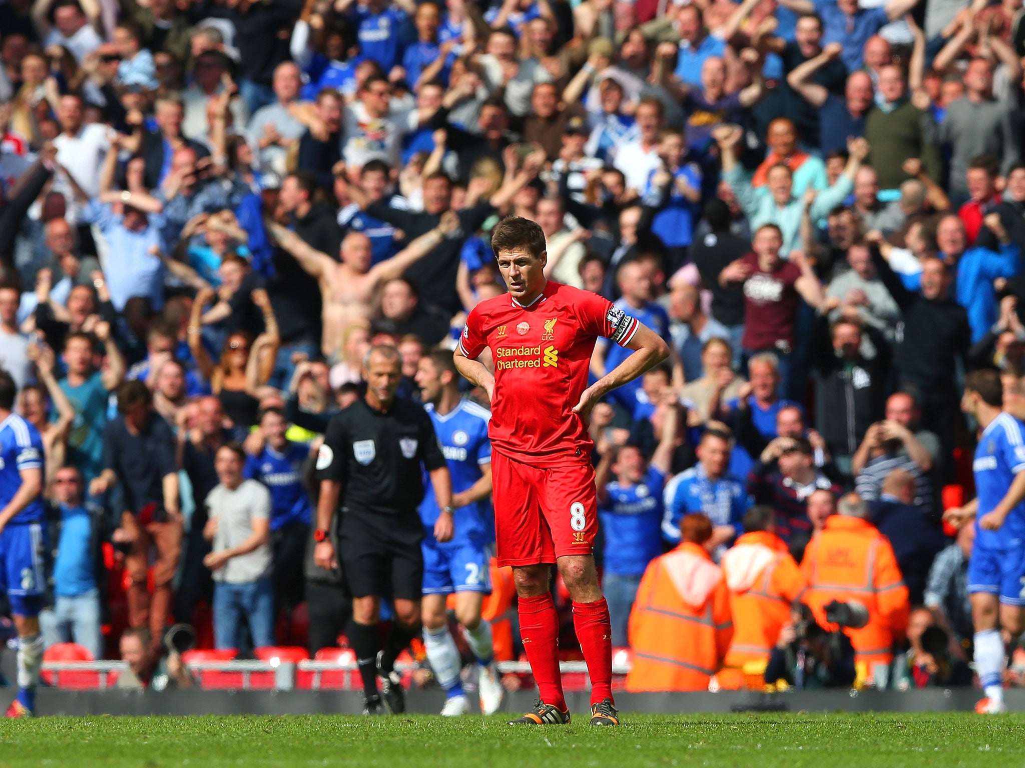 Gerrard stands dejected after the defeat to Chelsea in April 2014