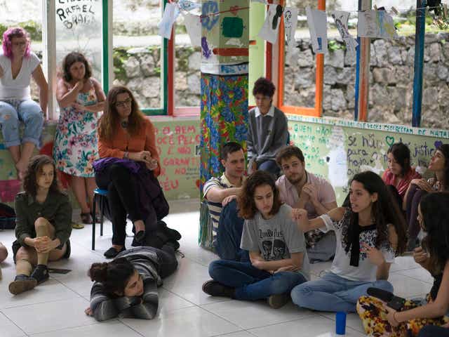 Ana Julia Pires Ribeiro, pointing, speaks during a debate with students about the occupation of their high school, Colegio Pedro II, that aims to protest education reform and austerity measures