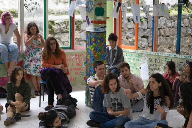 Ana Julia Pires Ribeiro, pointing, speaks during a debate with students about the occupation of their high school, Colegio Pedro II, that aims to protest education reform and austerity measures