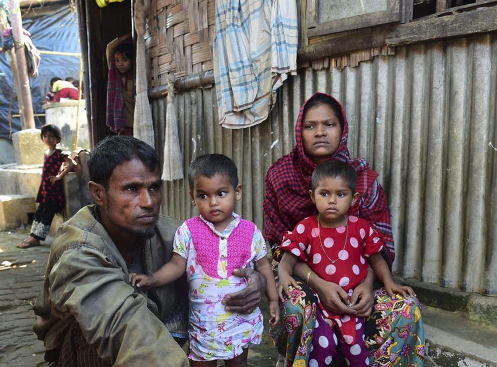 Deen Mohammad (L) and his wife Roshida (R), whose two elder sons were taken by the Burmese military, in a refugee camp in Teknaf in southern Cox's Bazar district