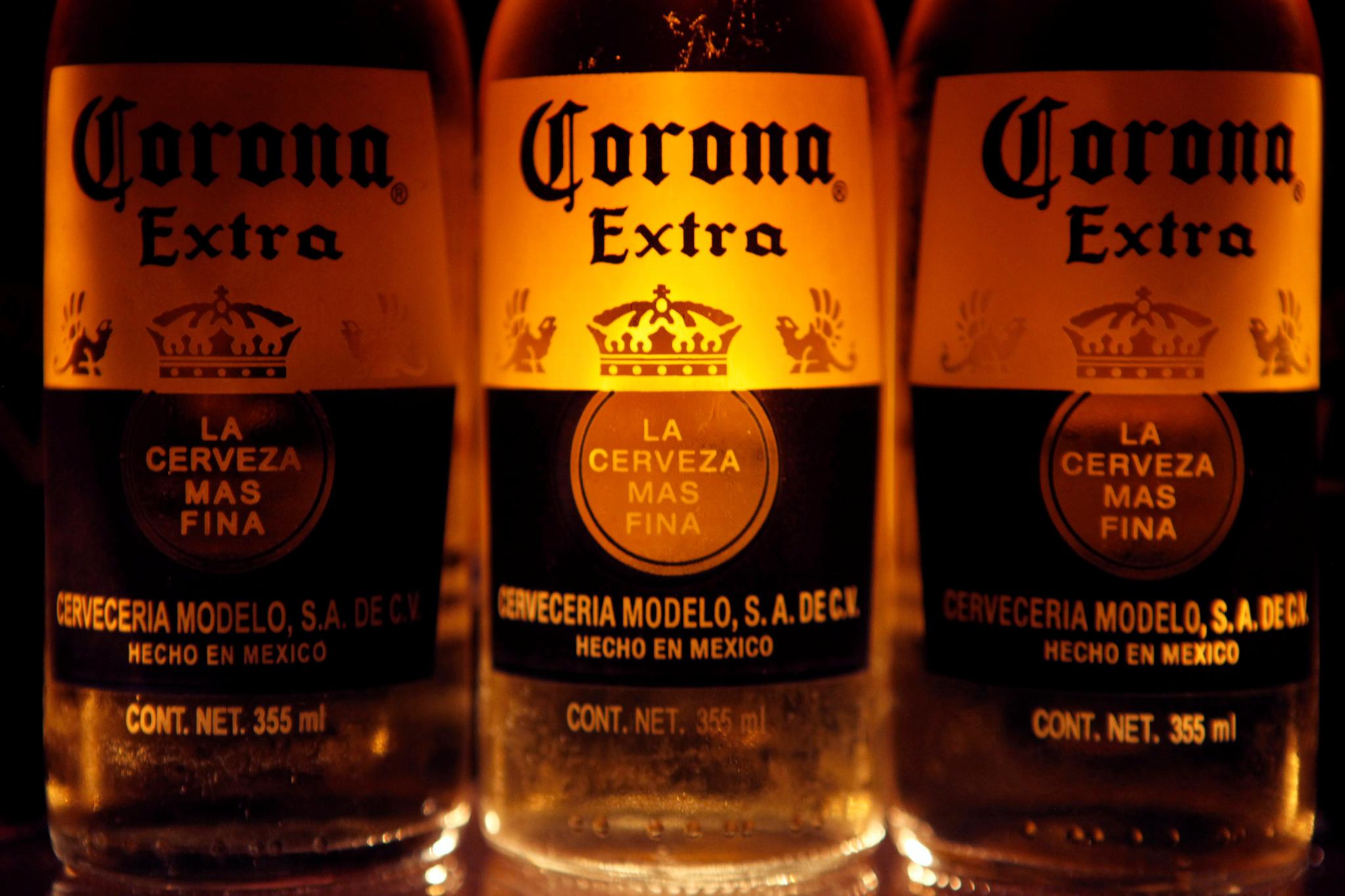 Bottles of Corona beer, the flagship brand of Group Modelo, are seen in Mexico City