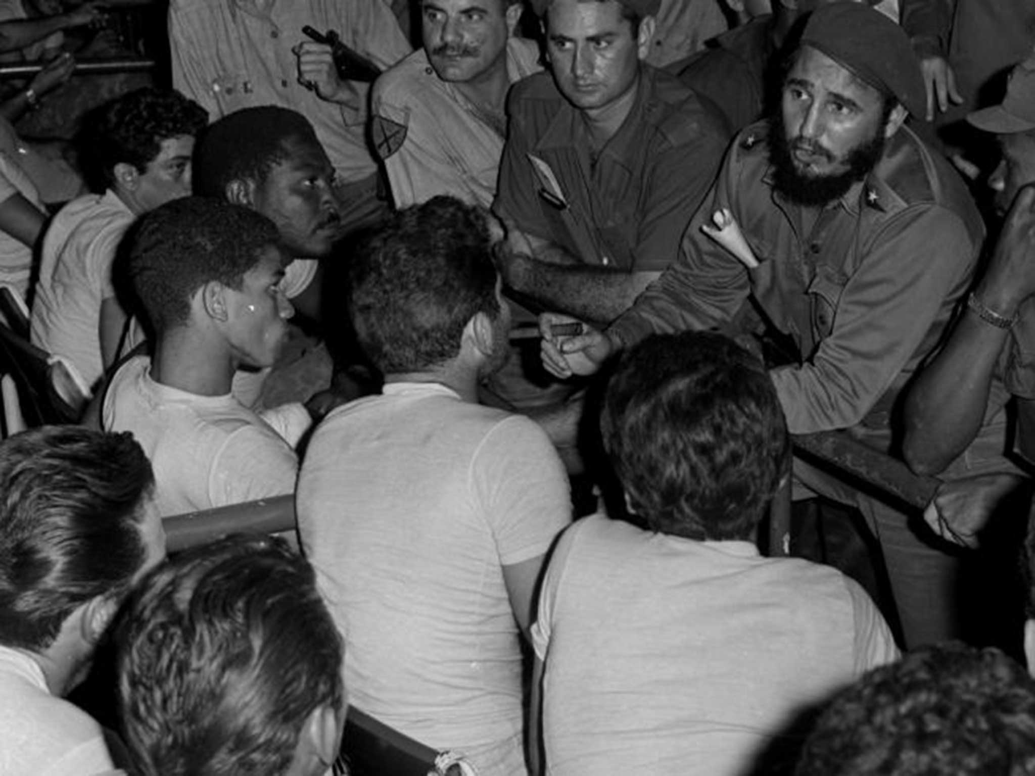 Fidel Castro speaks with prisoners from the Bay of Pigs invasion at the sports stadium in Havana, Cuba