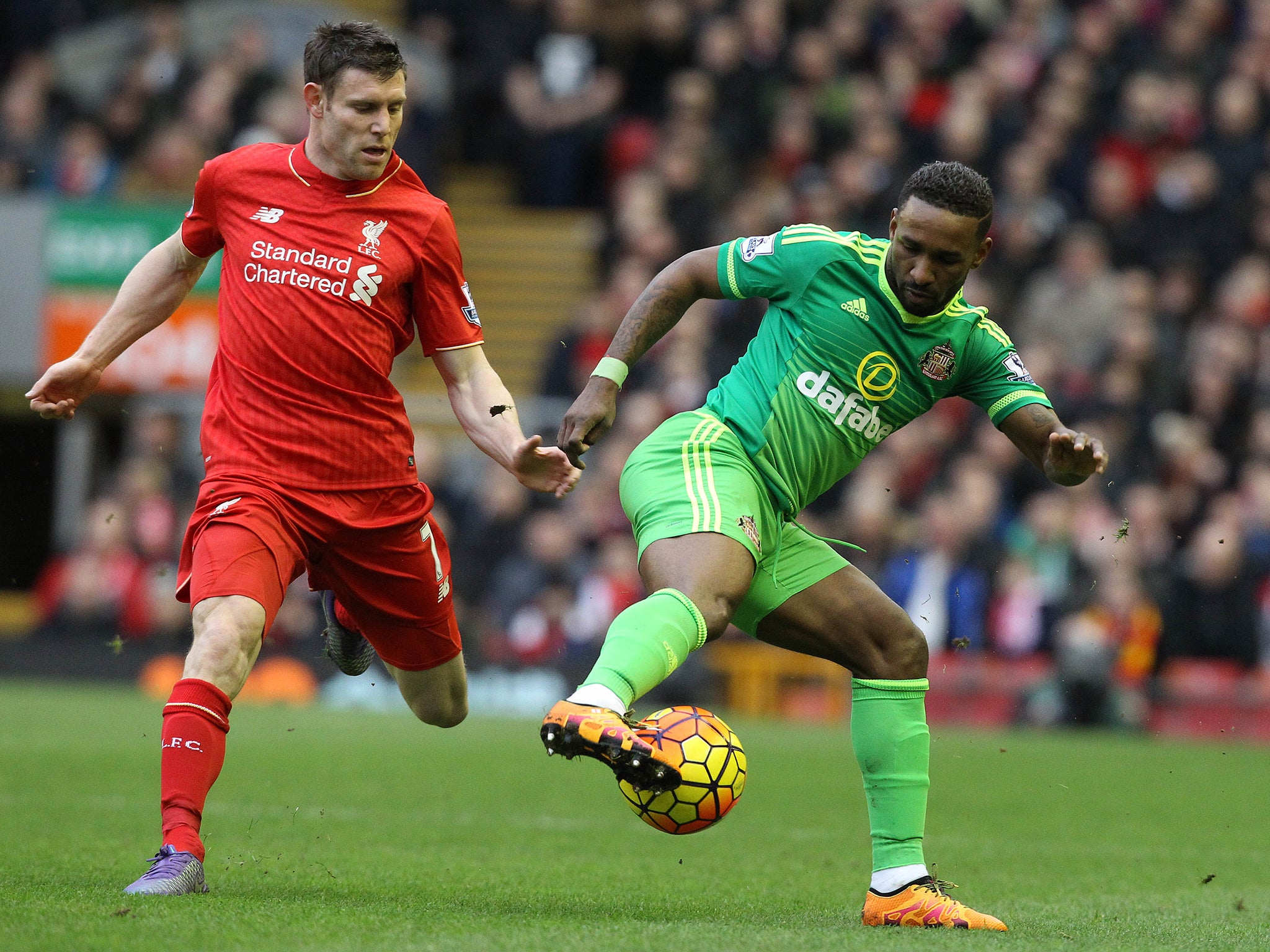 Milner closes down Defoe during last season's corresponding fixture