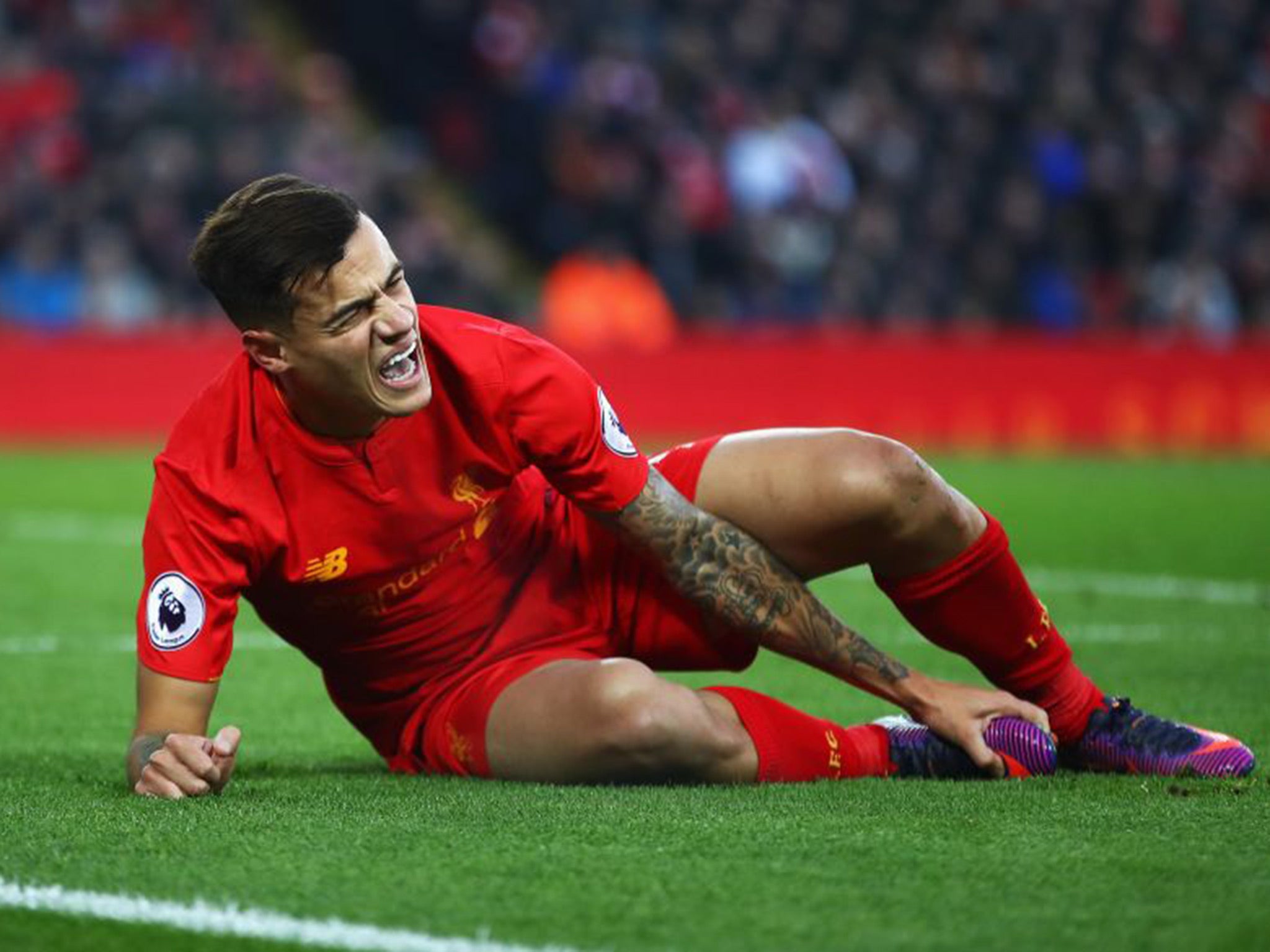 Coutinho was stretchered off and replaced by Divock Origi