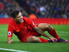 Coutinho stretchered off for Liverpool with suspected broken foot