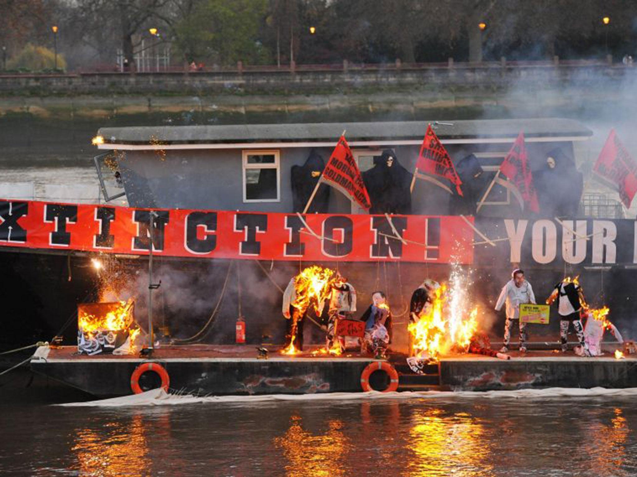 Joe Corre, the son of Vivienne Westwood and Sex Pistols creator Malcolm McLaren, burns his £5 million punk collection on a boat on the River Thames in London