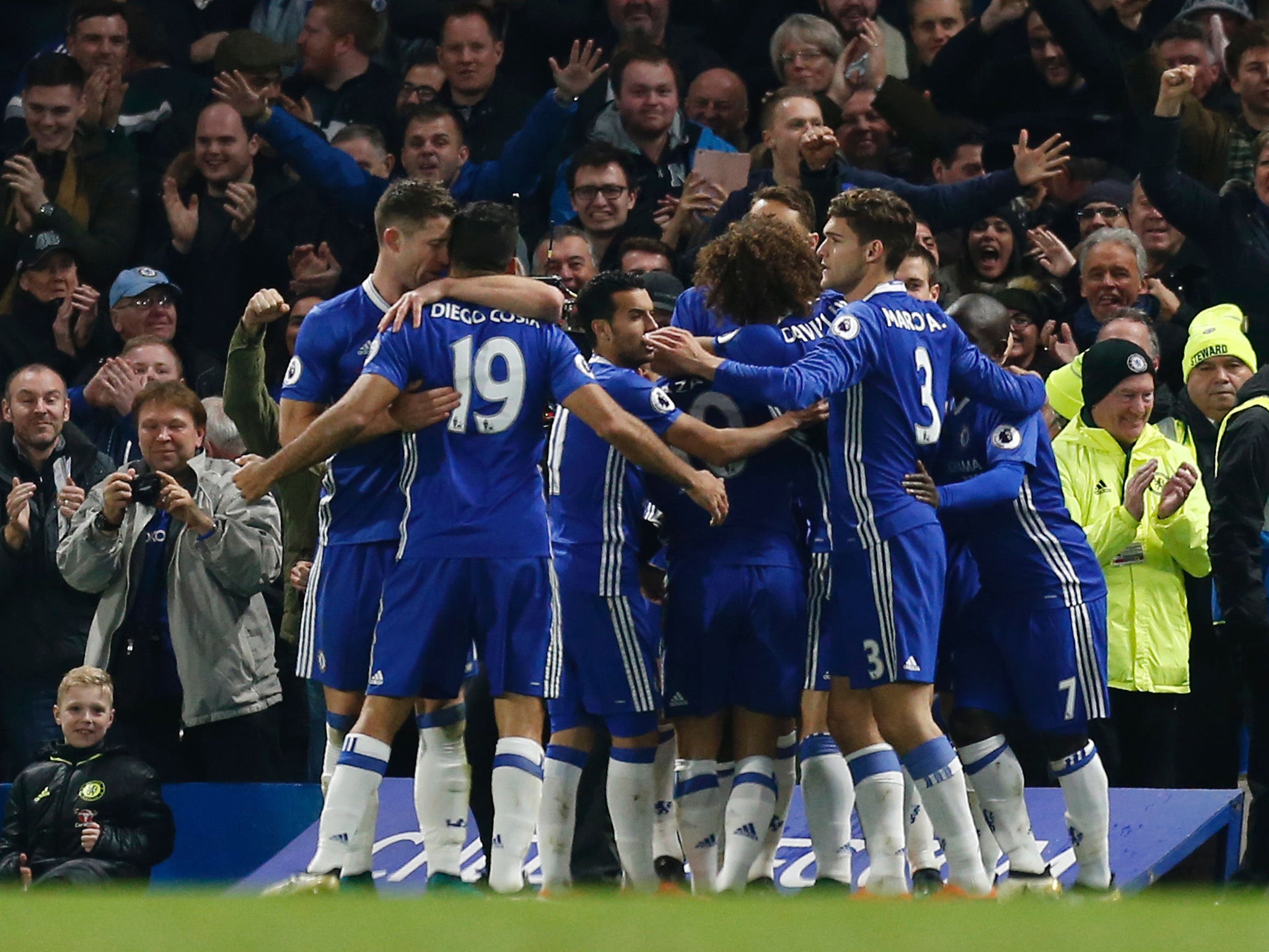 Chelsea players celebrate Moses' goal giving them the lead