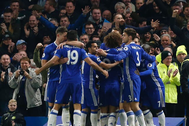 Chelsea players celebrate Moses' goal giving them the lead