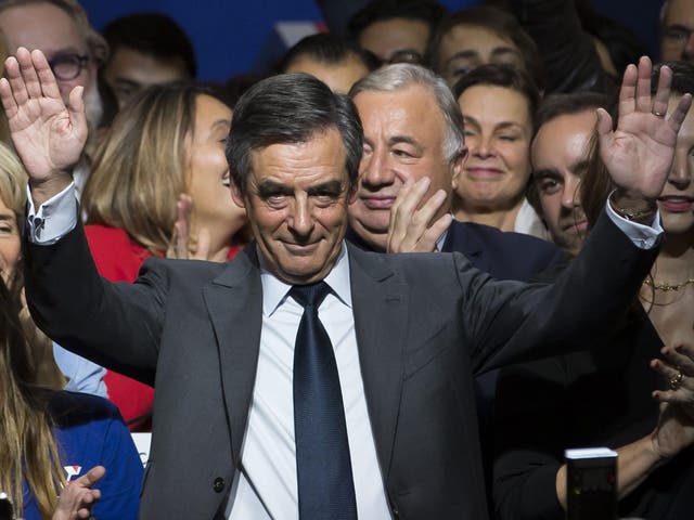 Francois Fillon waves during the national anthem during a political rally of the second round of the conservative presidential primary, in Paris, France, 25 November, 2016