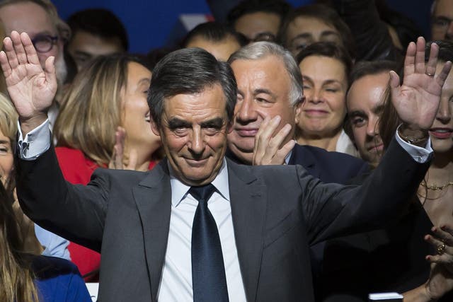 Francois Fillon waves during the national anthem during a political rally of the second round of the conservative presidential primary, in Paris, France, 25 November, 2016
