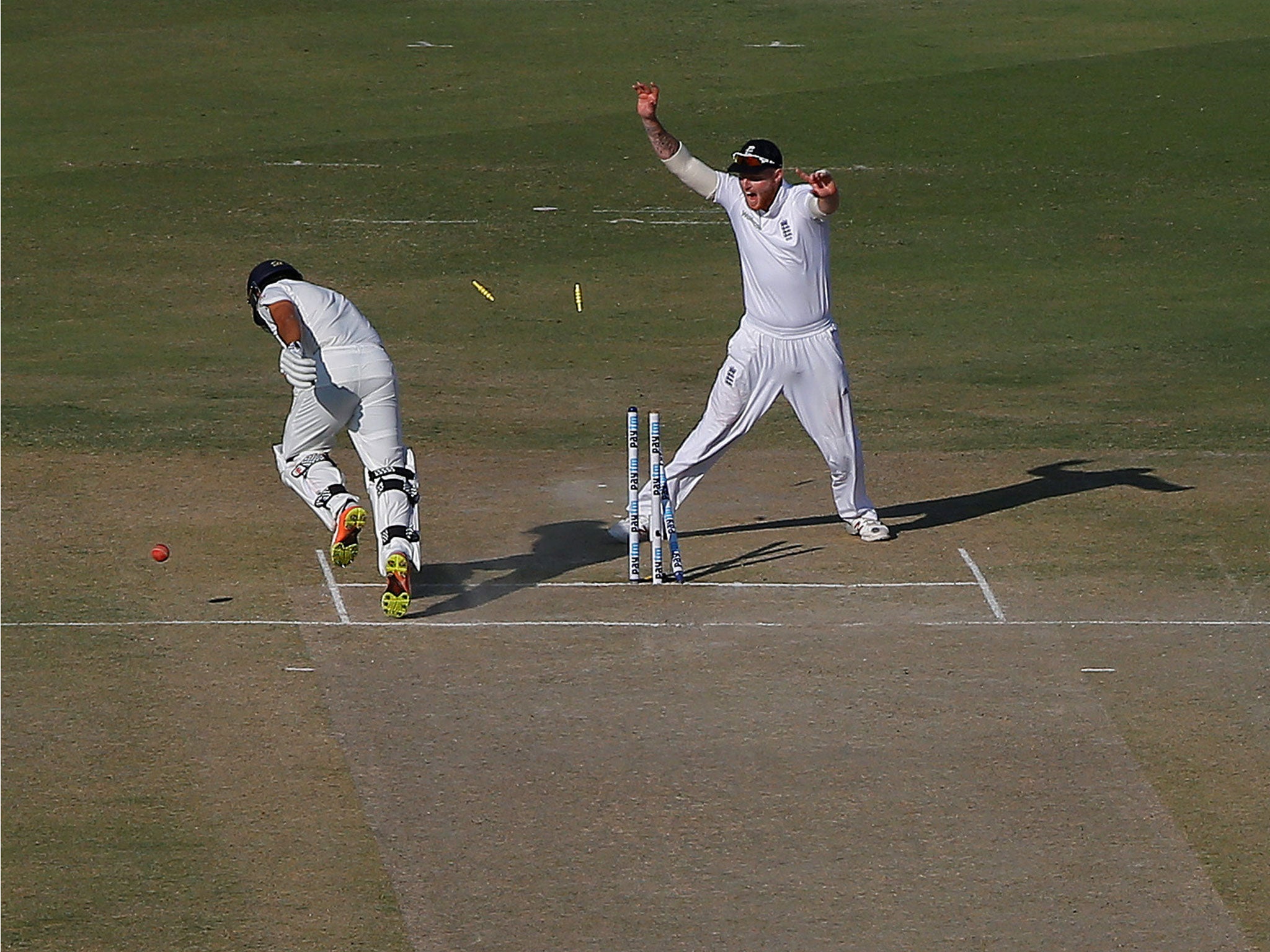 India's Karun Nair (L) is run out by Jos Buttler's diving stop-and-throw