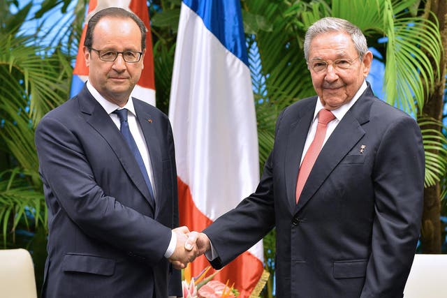 Francois Hollande (left) met Cuban president Raul Castro in Havana last year
