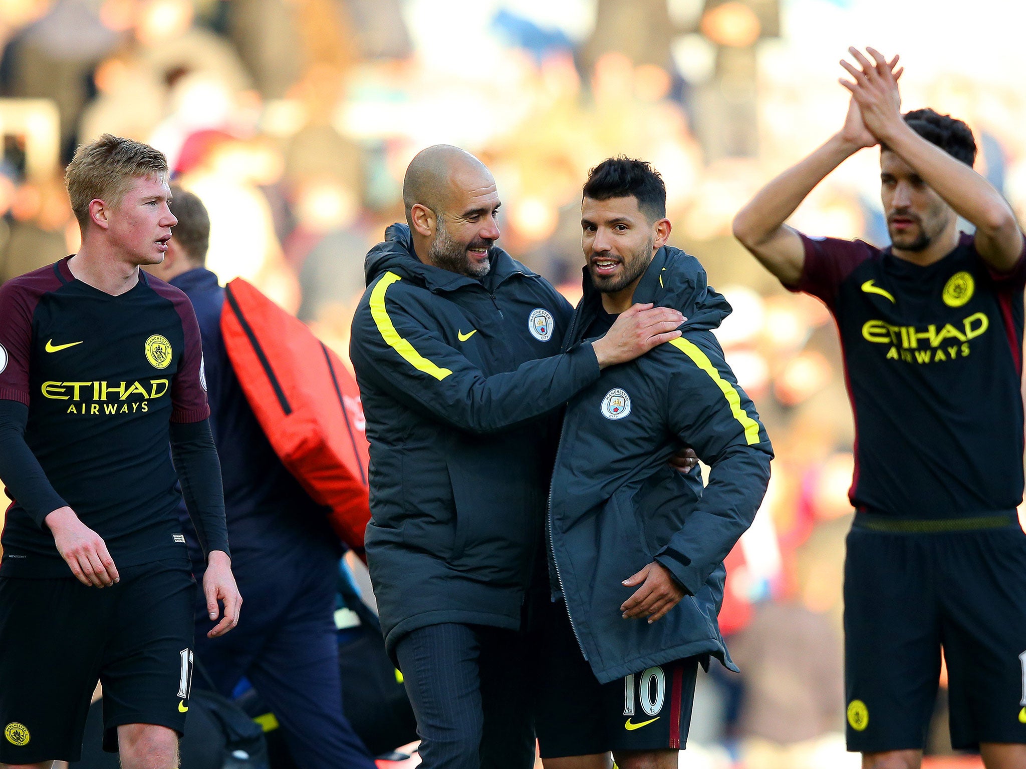 Pep Guardiola congratulates Sergio Aguero, who bagged a brace against Burnley, after the final whistle of Saturday's game