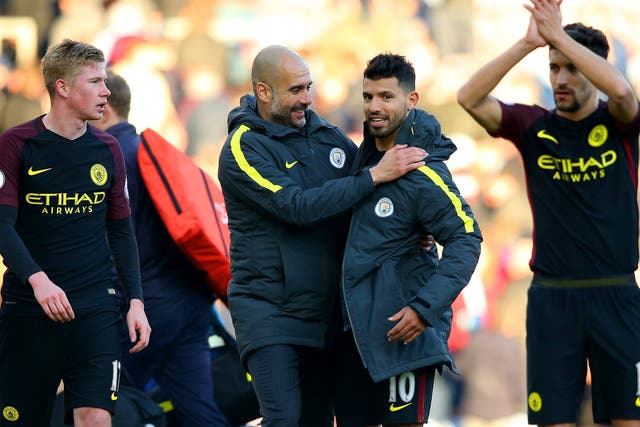 Pep Guardiola congratulates Sergio Aguero, who bagged a brace against Burnley, after the final whistle of Saturday's game
