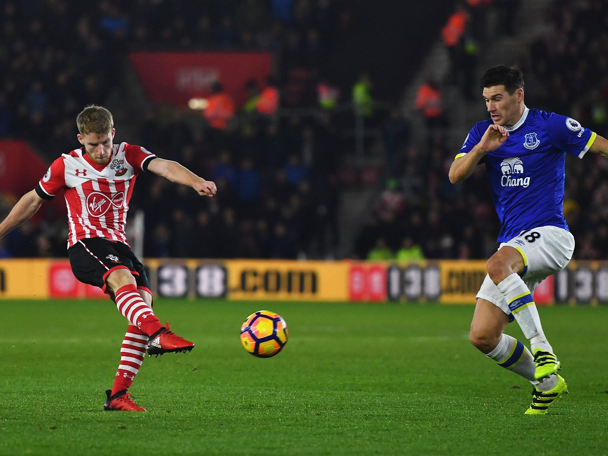 Josh Sims takes a shot on goal as Gareth Barry rushes to block