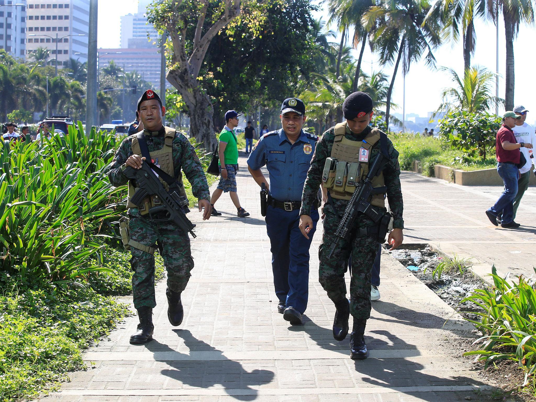 The Philippine police on patrol after an IED was found near the US embassy in Manila