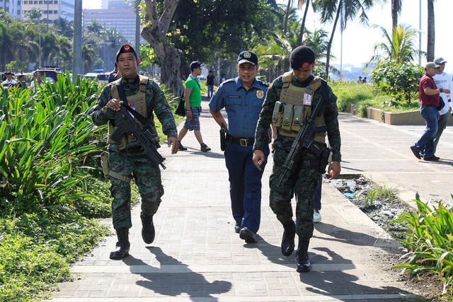 The Philippine police on patrol after an IED was found near the US embassy in Manila