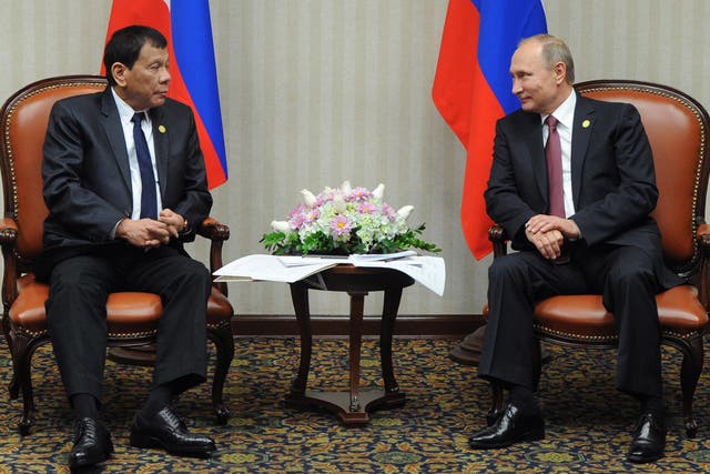 Russian President Vladimir Putin (R) meets with his Philippines' counterpart Rodrigo Duterte on the sidelines of the Asia-Pacific Economic Cooperation Summit (APEC) in Lima on November 19, 2016