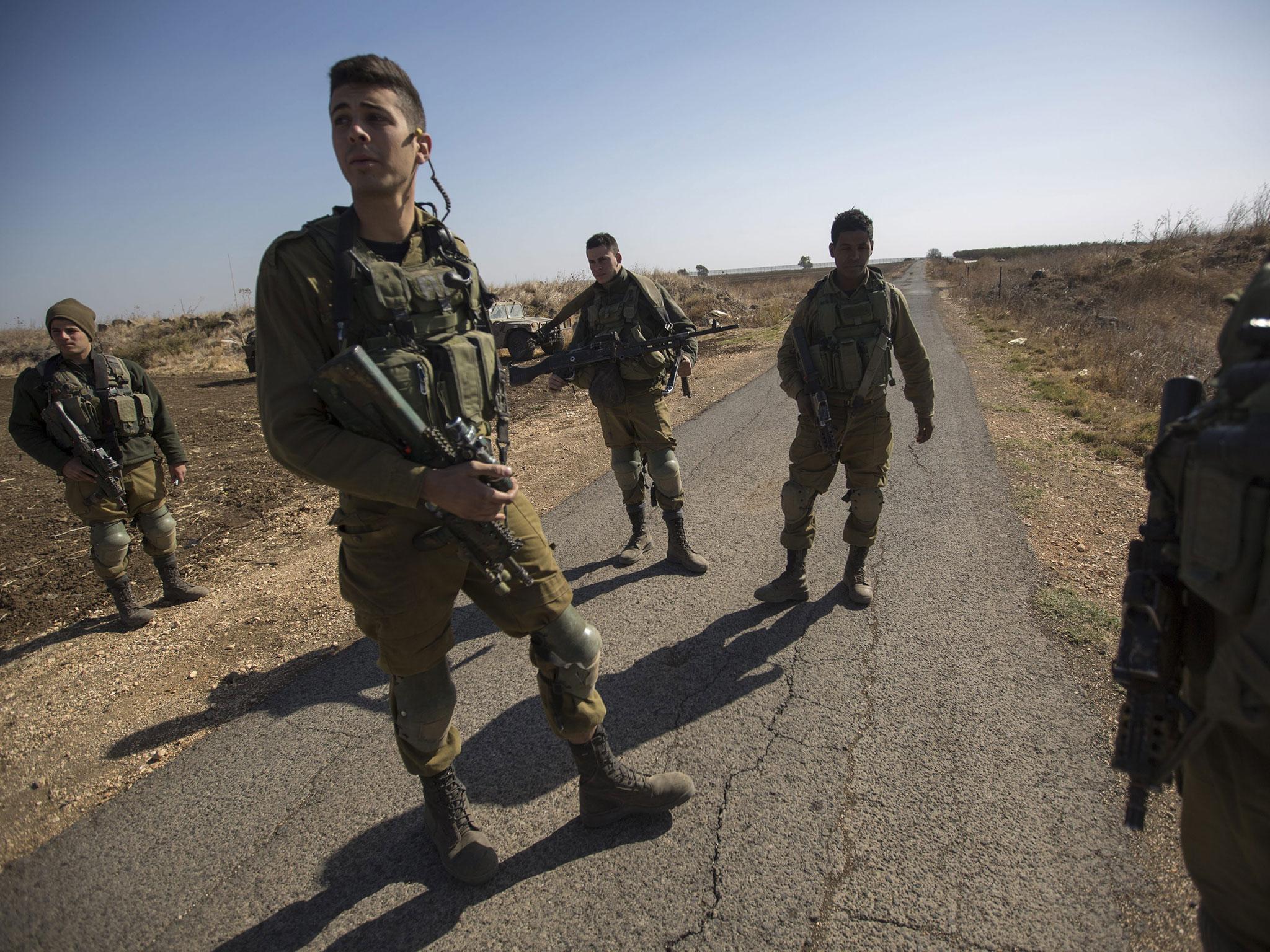 Israeli soldiers on the Syria border, near the village where Isis attacked the Israeli army