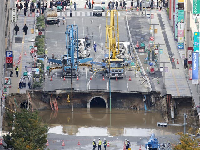 The sinkhole being repaied in Fukuoka