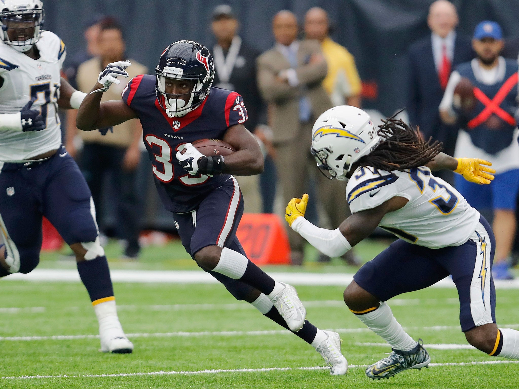 &#13;
Akeem Hunt #33 of the Houston Texans runs the ball defended by Jahleel Addae #37 of the San Diego Chargers in the first quarter at NRG Stadium on November 27, 2016 &#13;