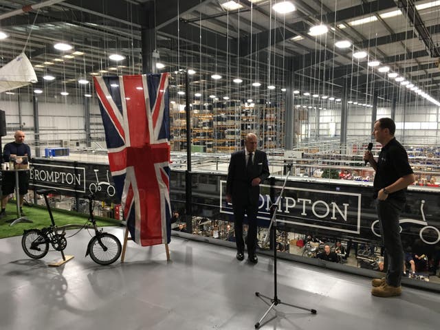 Ready to roll: Will Butler-Adams, Chief Executive of Brompton, invites the Duke of Edinburgh to open the new factory