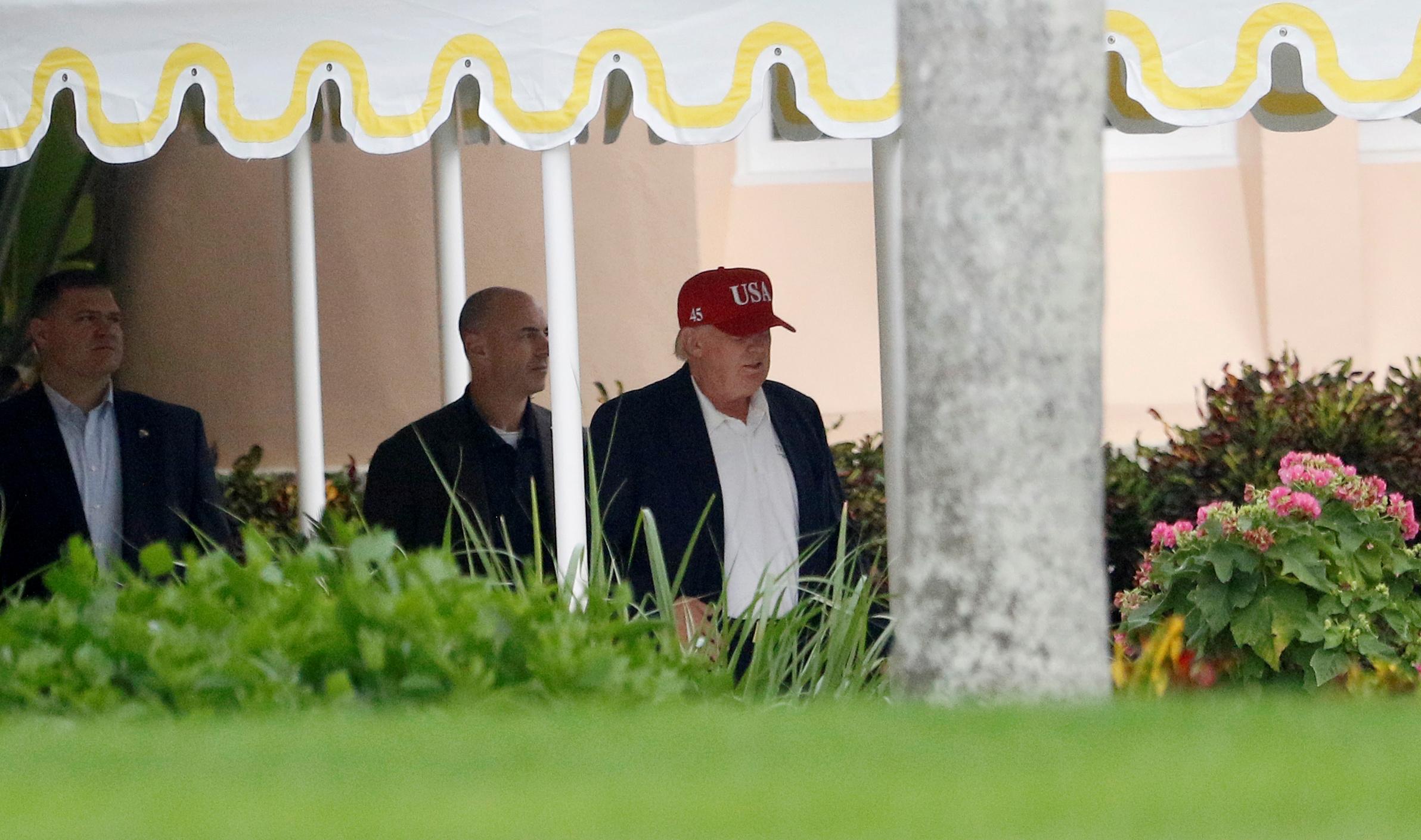 Mr Trump leaving his Mar-a-Lago resort in the new hat