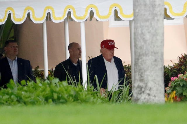 Mr Trump leaving his Mar-a-Lago resort in the new hat