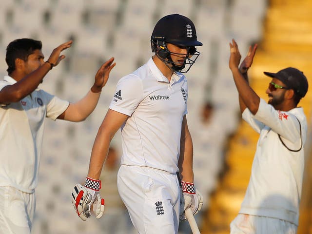 India's Umesh Yadav and Ajinkya Rahane celebrate the dismissal of England's Chris Woakes on the fourth day of the third Test