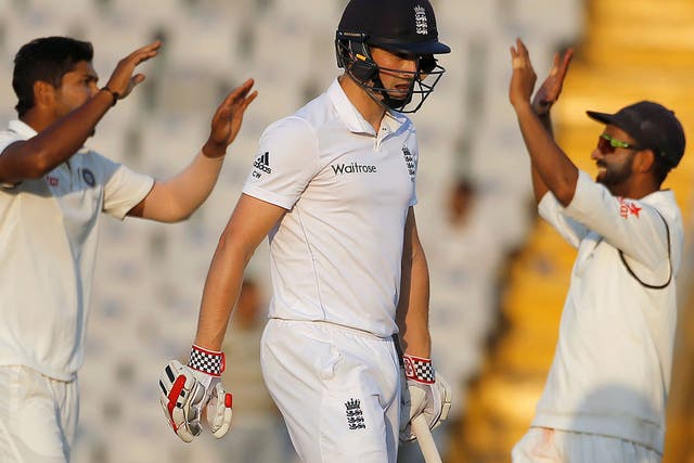 India's Umesh Yadav and Ajinkya Rahane celebrate the dismissal of England's Chris Woakes on the fourth day of the third Test