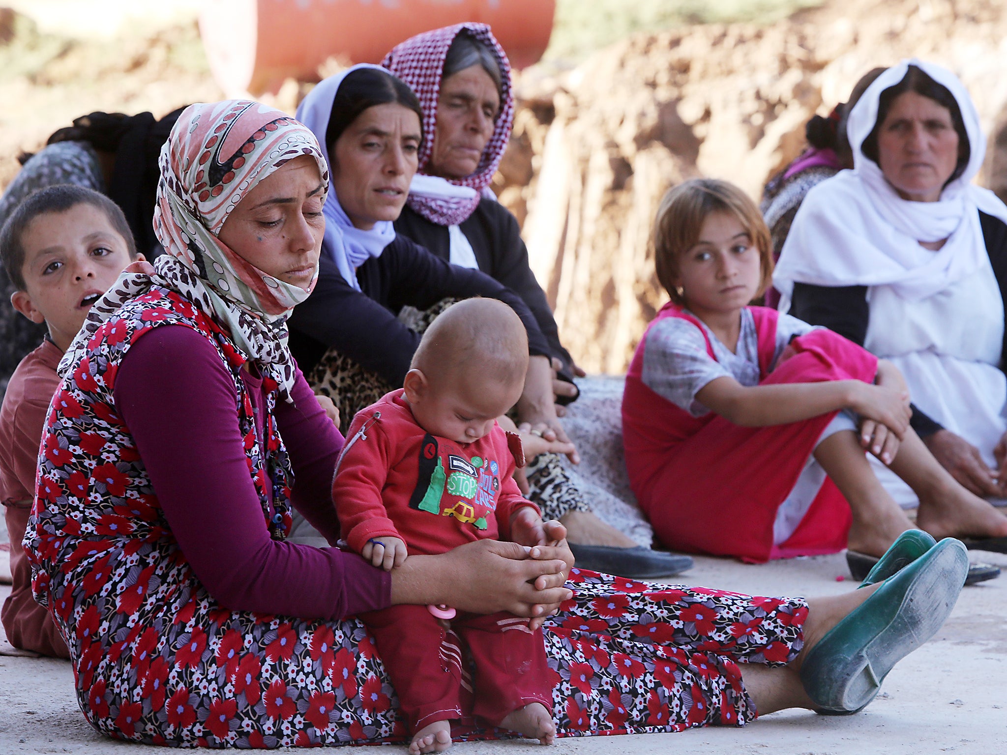 &#13;
Yazidi women and children were separated from men, who were systematically massacred (Getty)&#13;