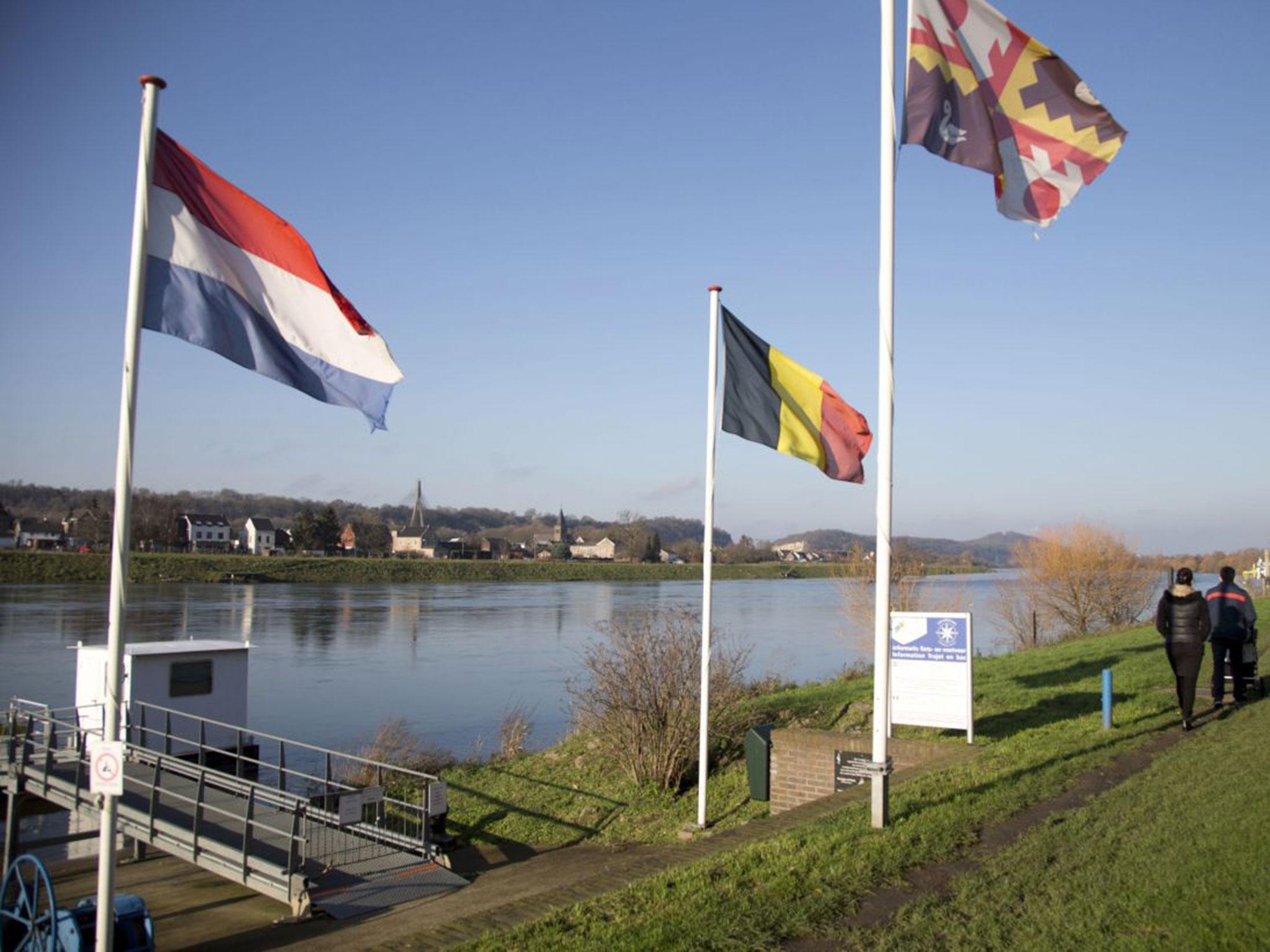 File photo showing the Dutch and Belgian flags on the waterfront in Eijsden, Netherlands
