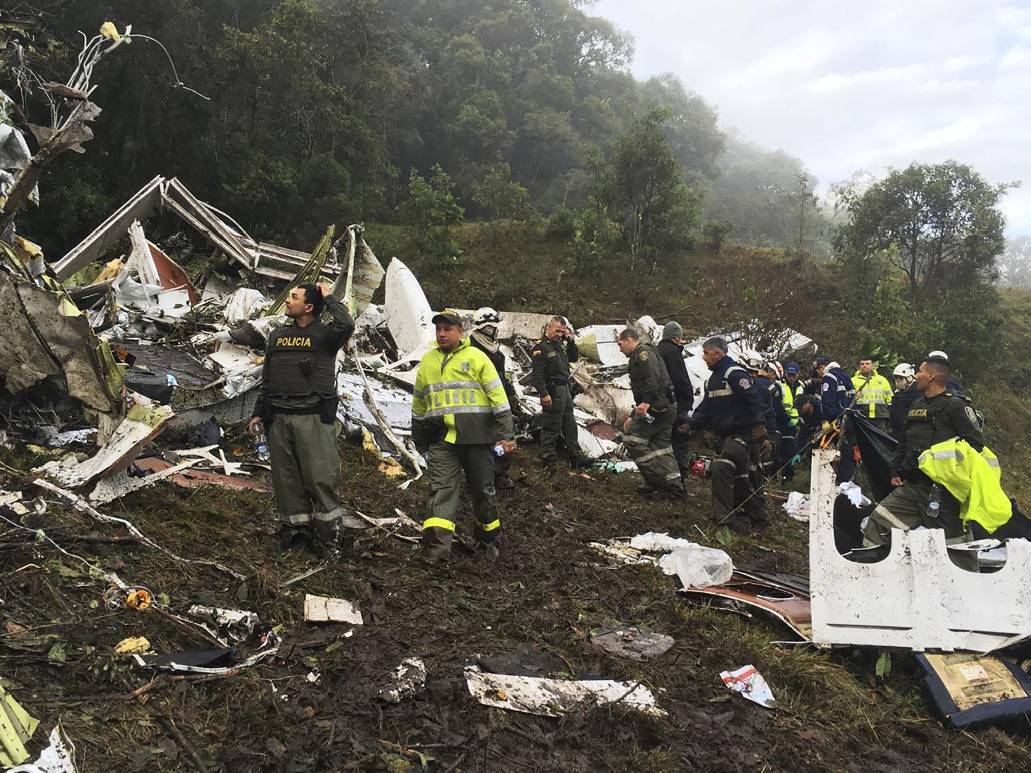 Rescue teams work at the site of a chartered airplane that crashed in La Union, a mountainous area outside Medellin, Colombia