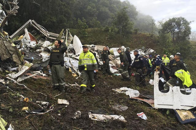 Rescue teams work at the site of a chartered airplane that crashed in La Union, a mountainous area outside Medellin, Colombia