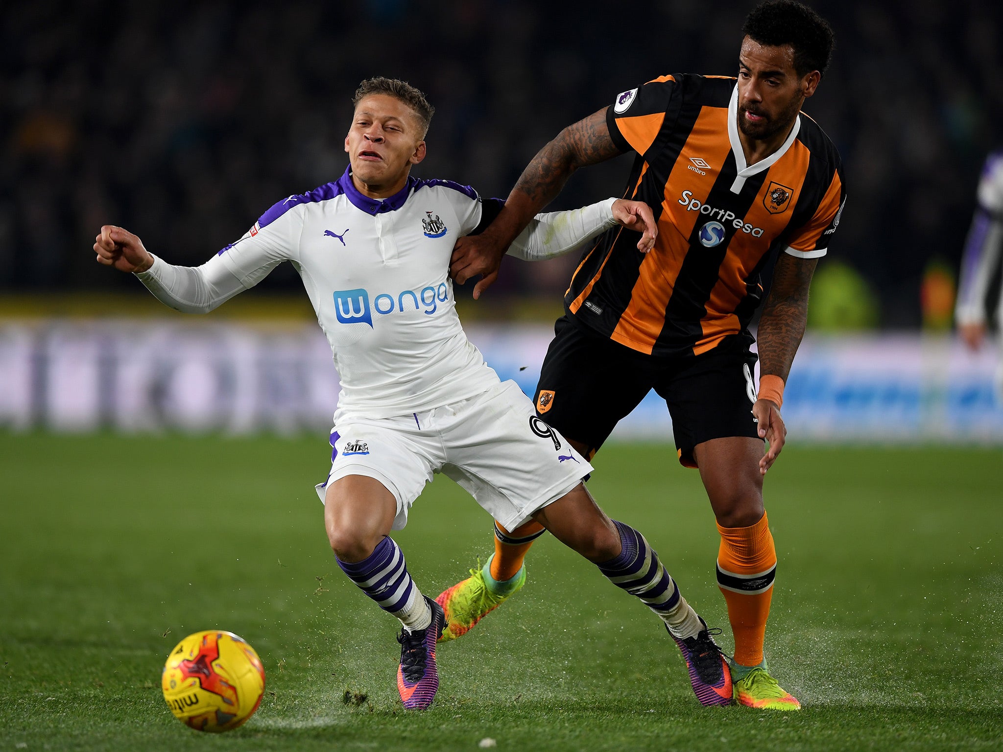 Huddlestone and Gayle battle for the ball at the KCOM Stadium