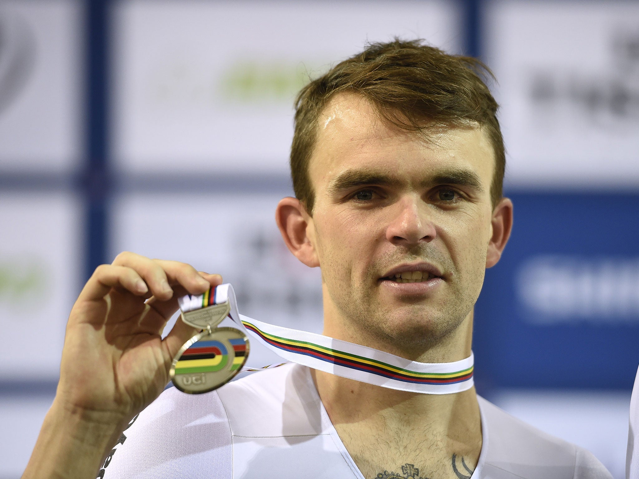 Second-placed Australia's Jack Bobridge celebrates on the podium after the Men's Individual pursuit at the UCI Track Cycling World Championships in Saint-Quentin-en-Yvelines, near Paris, on February 21, 2015