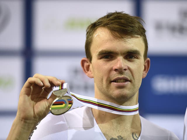 Second-placed Australia's Jack Bobridge celebrates on the podium after the Men's Individual pursuit at the UCI Track Cycling World Championships in Saint-Quentin-en-Yvelines, near Paris, on February 21, 2015