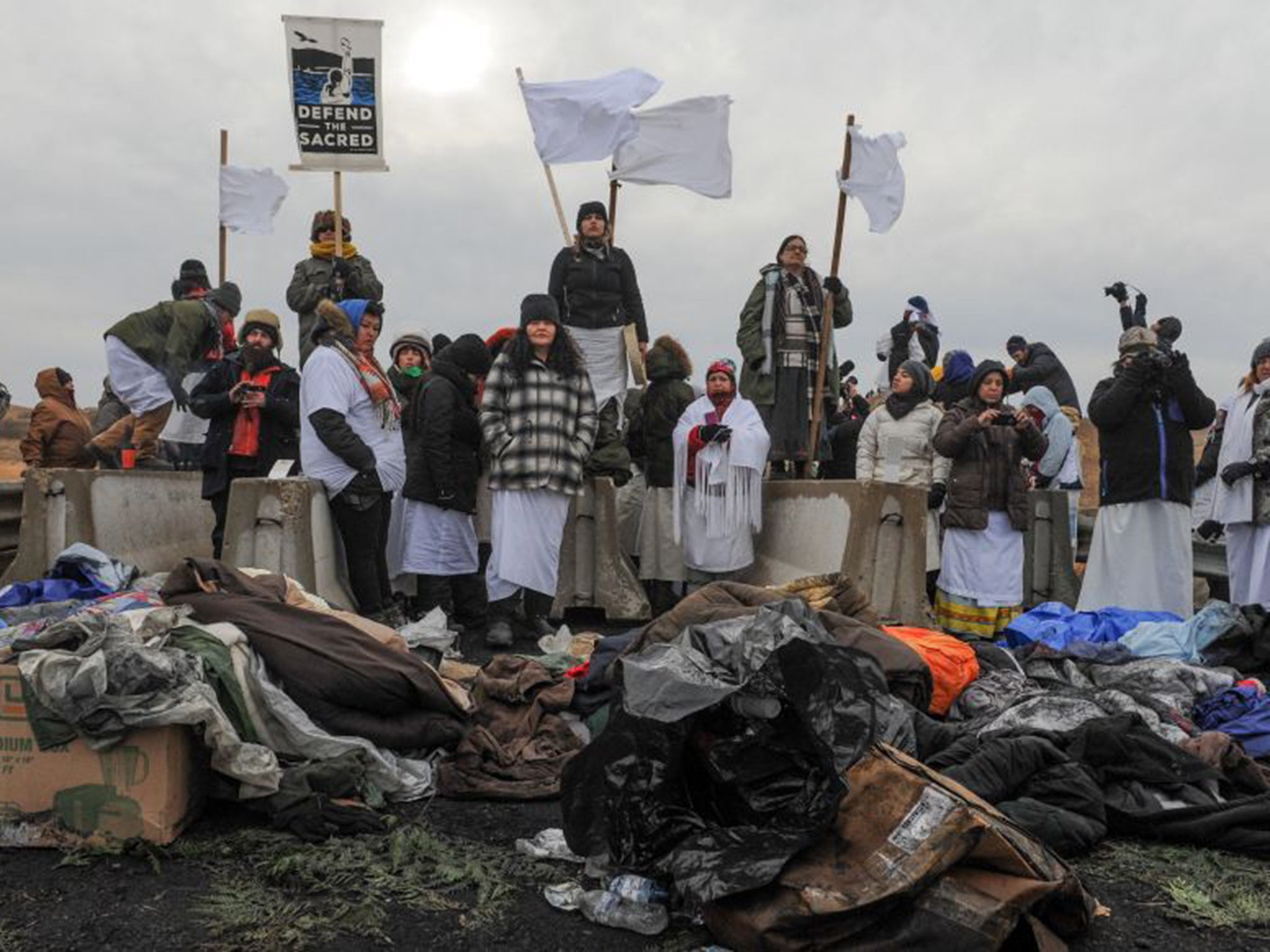 Women hold a demonstration on Backwater Bridge during a protest against plans to pass the Dakota Access pipeline near the Standing Rock Indian Reservation