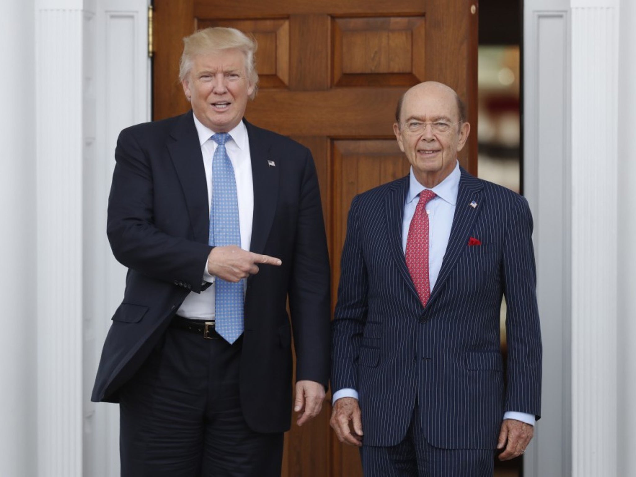 President-elect Donald Trump, seen here with investor Wilbur Ross, is offering exclusive access to major backers