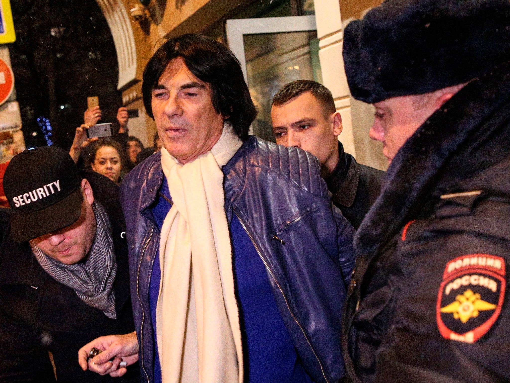 French composer Didier Marouani is detained by police outside a bank in Moscow