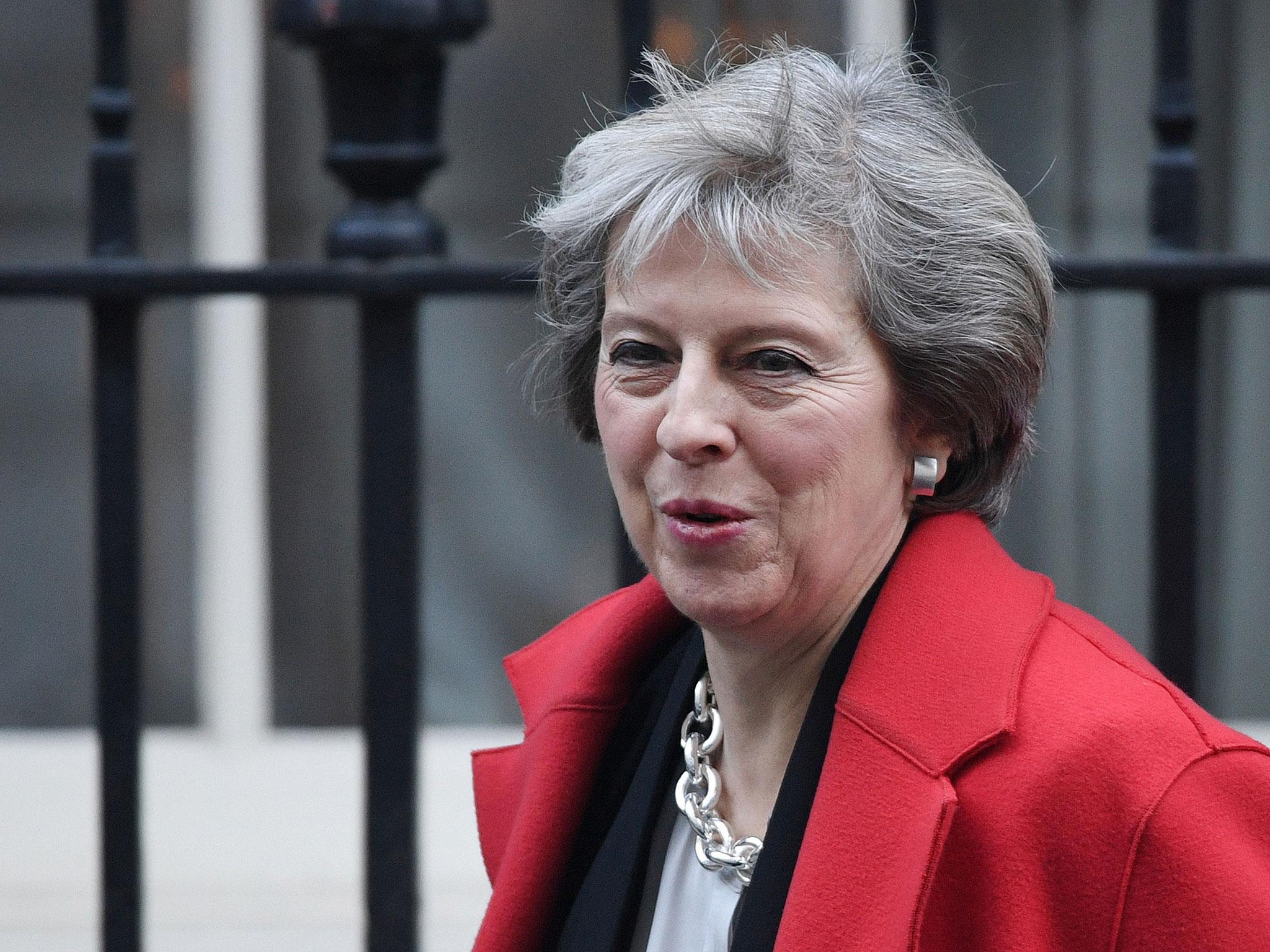 Theresa May leaves Downing Street for Prime Minister's Questions in the Commons