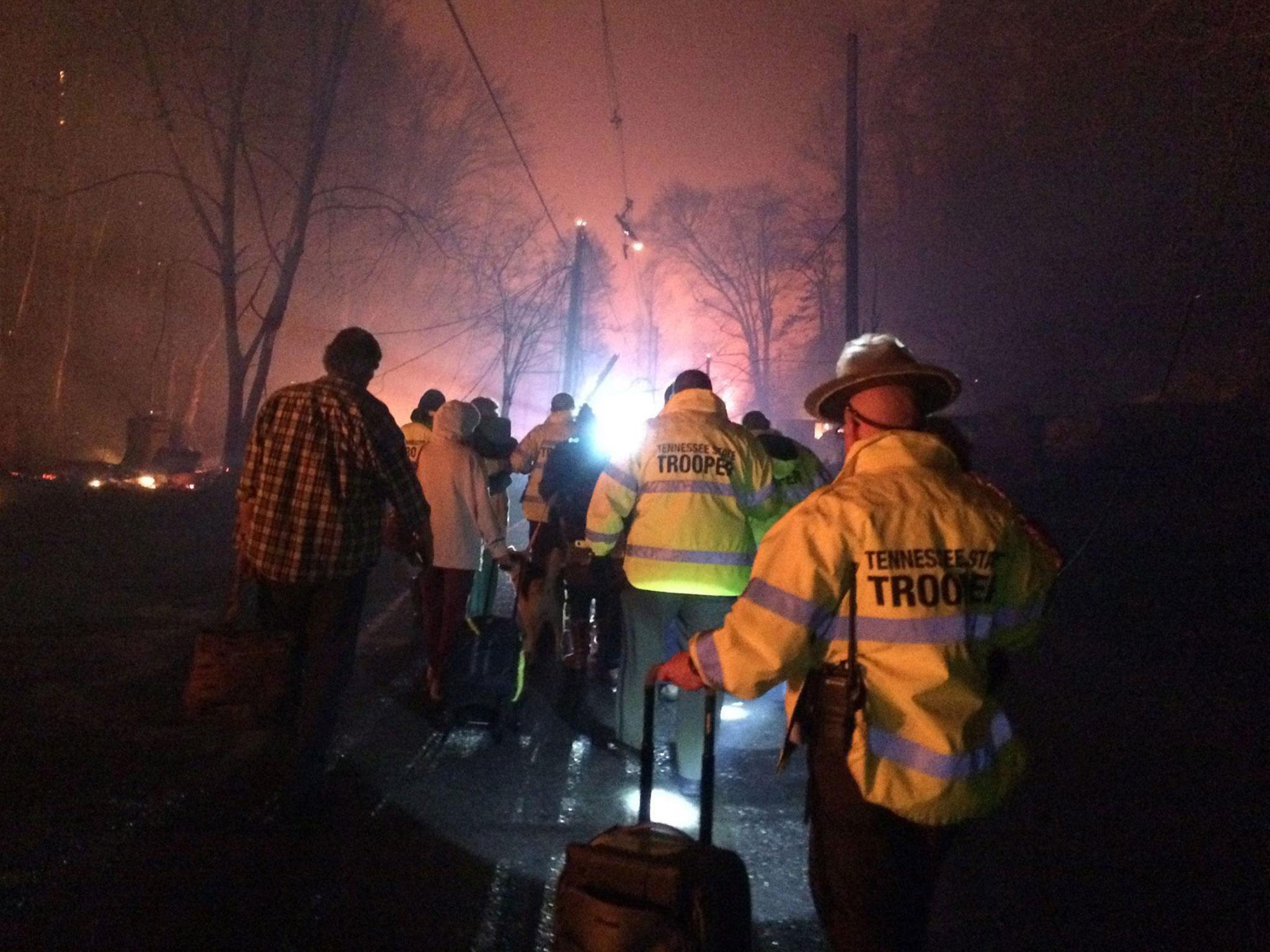 Tennessee State Troopers helping residents evacuate areas threatened by wildfires
