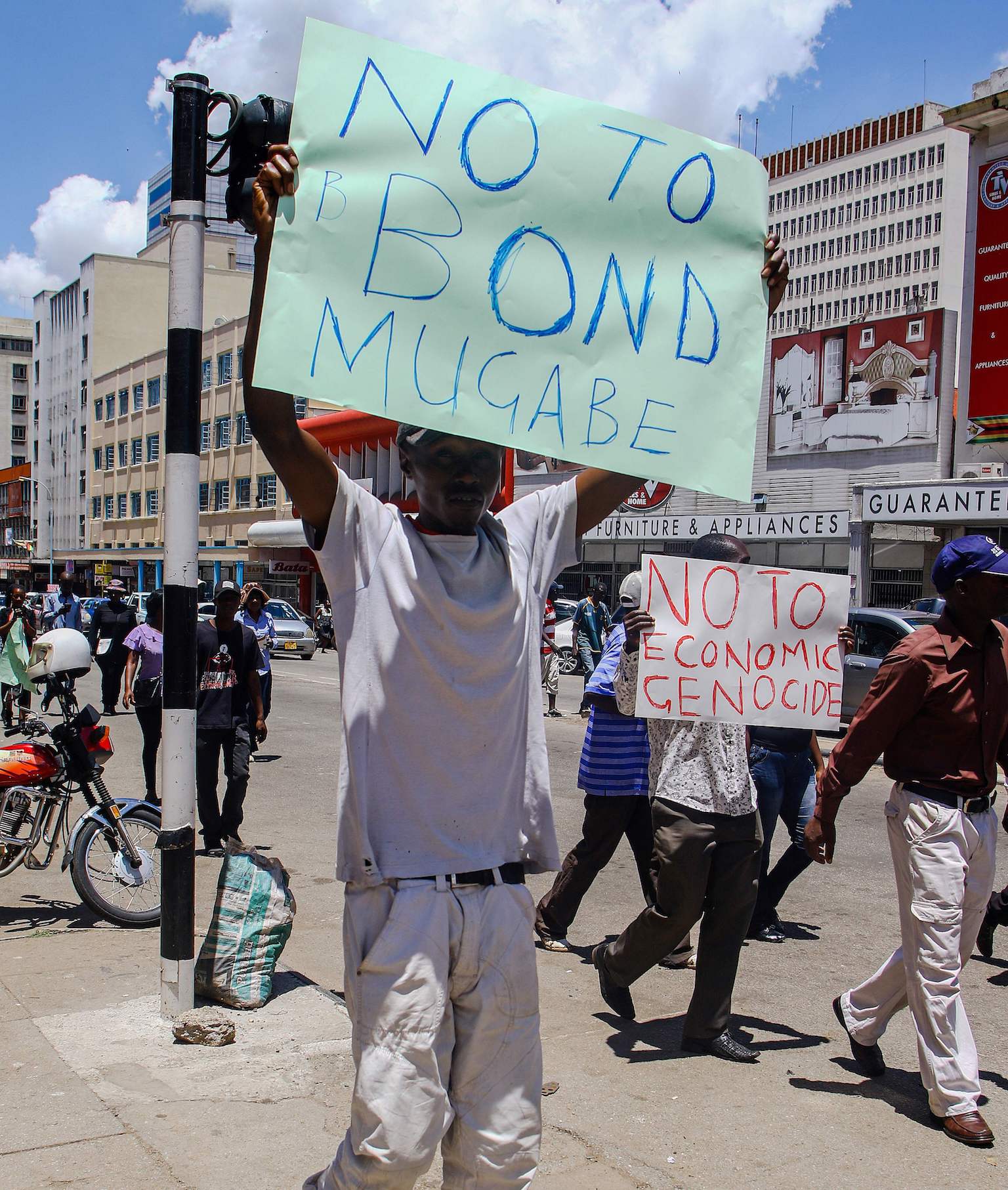 A protester holds a sign during the demonstrations in Harare