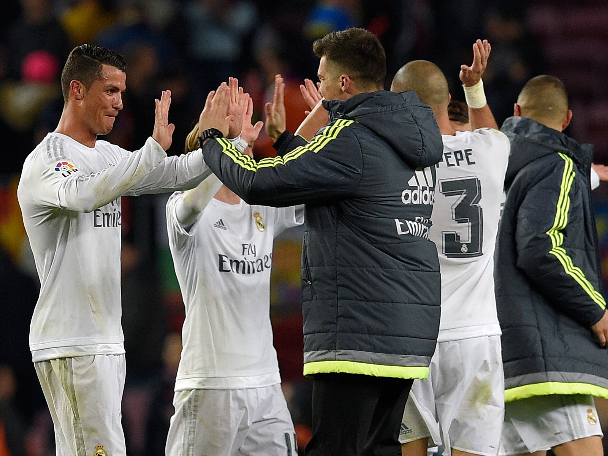 Madrid's players celebrate their late victory at the Nou Camp last season