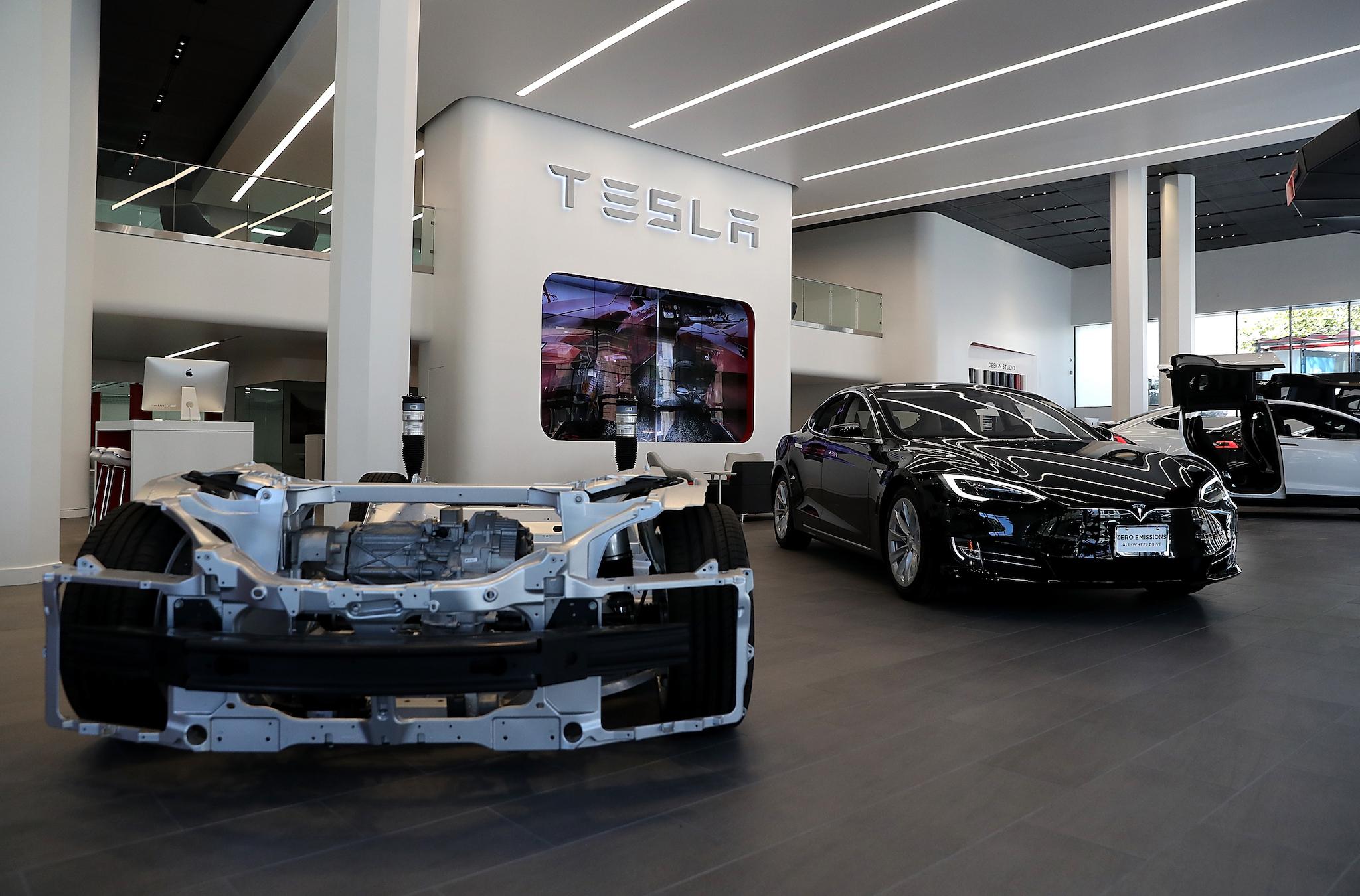 A Tesla Model S is displayed inside of the new Tesla flagship facility in San Francisco, California