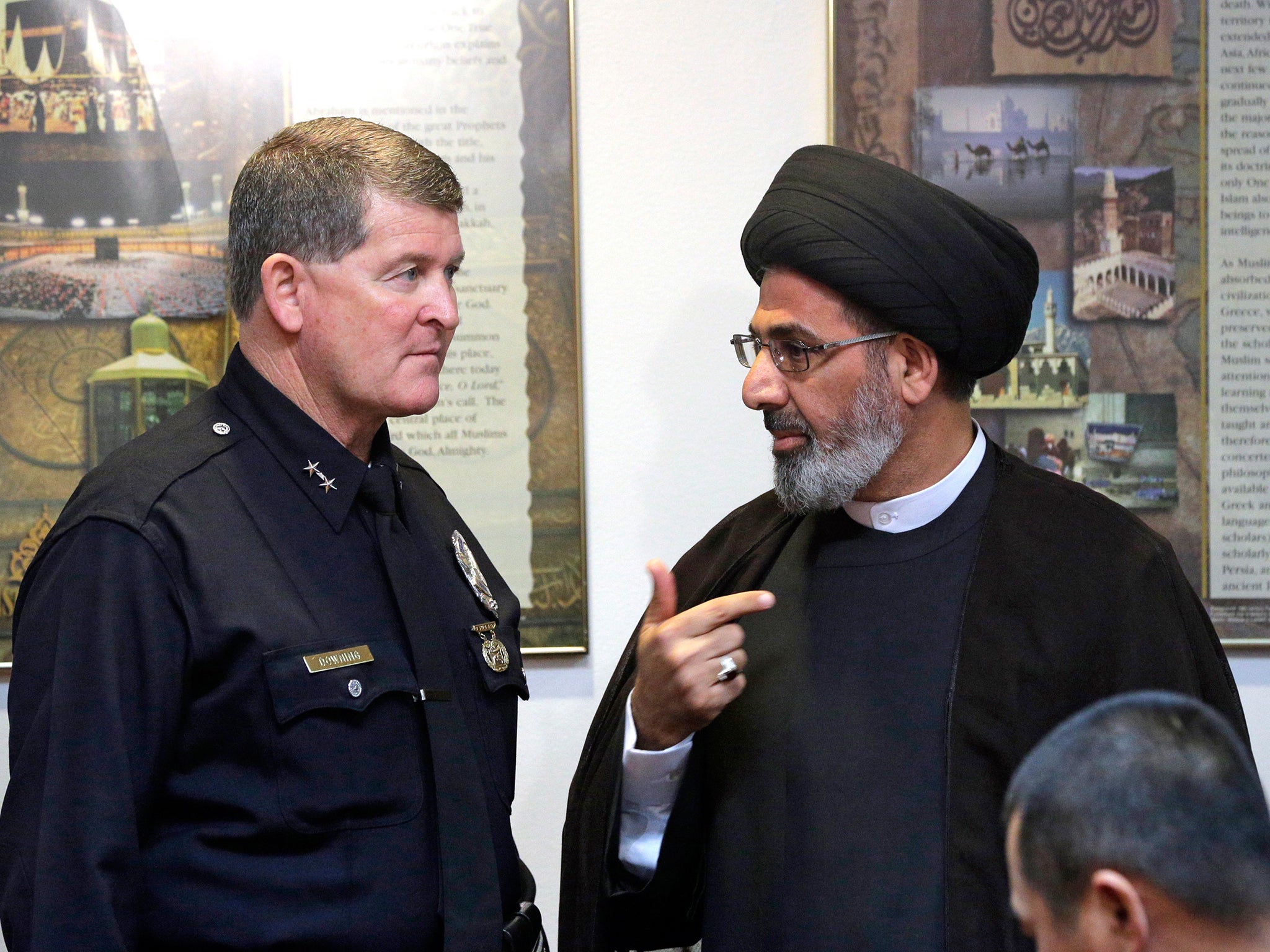Los Angeles Police Deputy Chief Michael Downing meets with Iman Sayed Moustafa al-Qazwini at the Islamic Educational Center of Orange County to discuss the spate of threatening letters