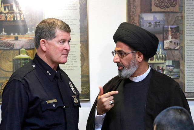 Los Angeles Police Deputy Chief Michael Downing meets with Iman Sayed Moustafa al-Qazwini at the Islamic Educational Center of Orange County to discuss the spate of threatening letters