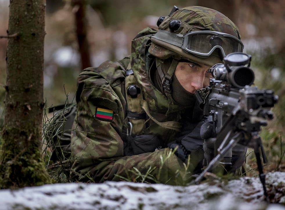 A Lithuanian soldier practices during a NATO military exercise, 'Iron Sword,' at the Rukla military base some 130 km (80 miles) west of the capital Vilnius, Lithuania